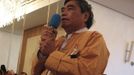 An unidentified member of the opposition National League for Democracy takes the opportunity and asks the Singaporean MP Charles Chong about his government's open-door policy towards the senior members of the Burmese junta