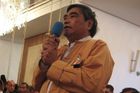 An unidentified member of the opposition National League for Democracy takes the opportunity and asks the Singaporean MP Charles Chong about his government's open-door policy towards the senior members of the Burmese junta
