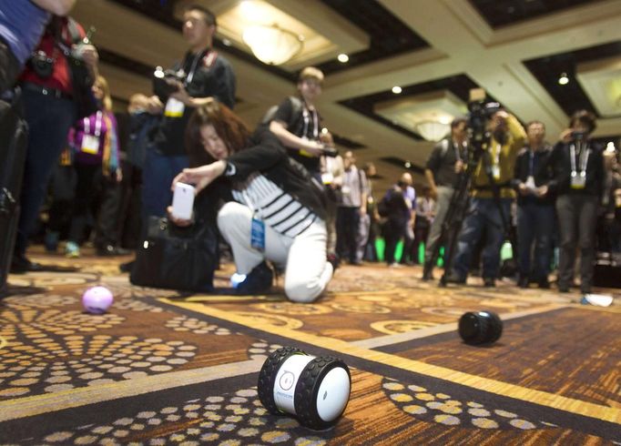 A woman takes a photo of a Sphero 2.0 by Orbotix during &quot;CES Unveiled,&quot; a media preview event to the annual Consumer Electronics Show (CES), in Las Vegas, Nevad