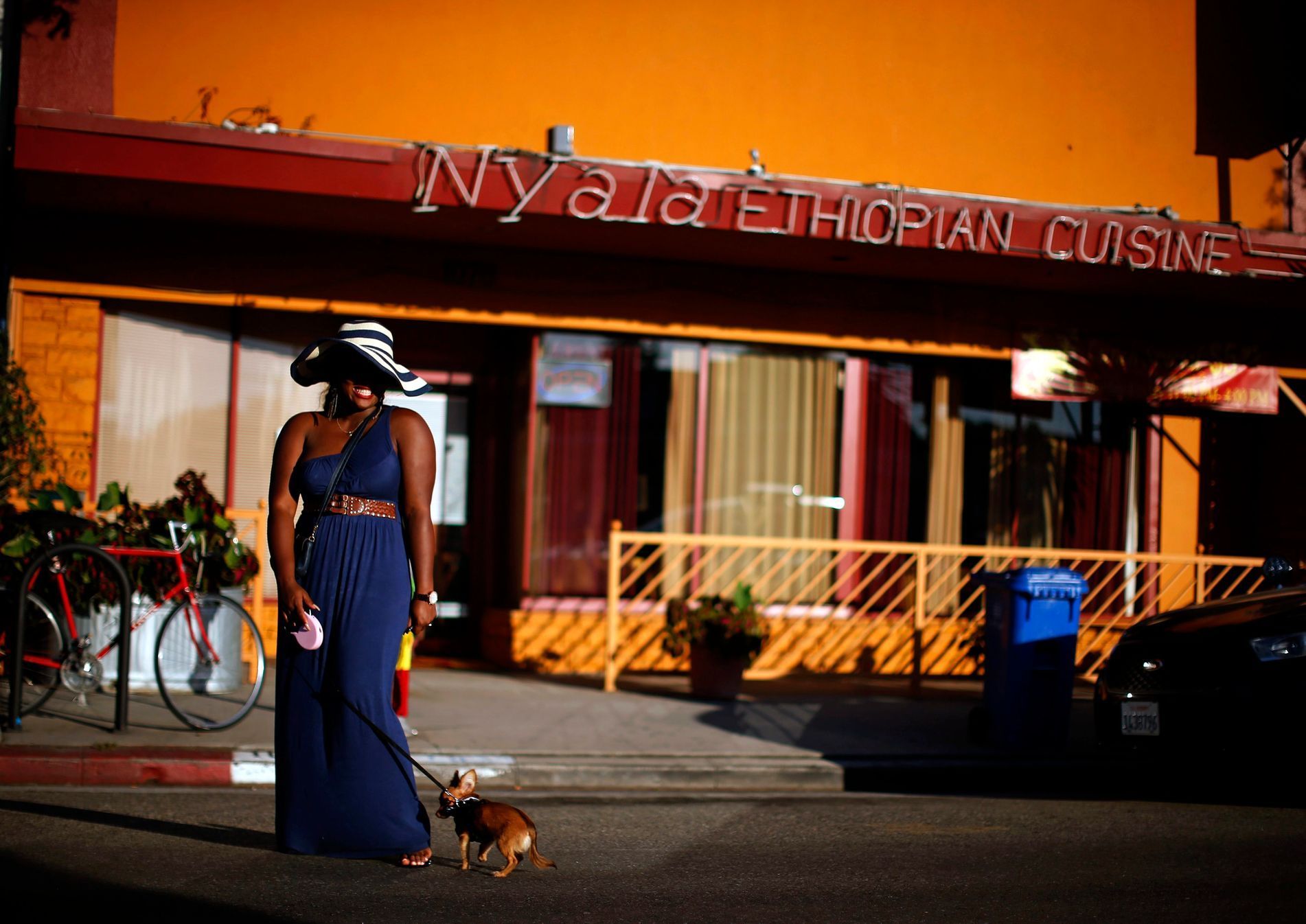 Woman poses for a friend's photo in the Little Ethiopia area of Los Angeles