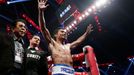 Manny Pacquiao of the Philippines celebrates his victory over Chris Algieri of the U.S. during their World Boxing Organisation (WBO) 12-round welterweight title fight at