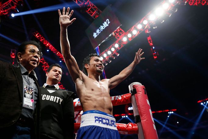 Manny Pacquiao of the Philippines celebrates his victory over Chris Algieri of the U.S. during their World Boxing Organisation (WBO) 12-round welterweight title fight at