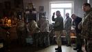 Servicemen attend a mass in an Orthodox church near the front lines in the Donetsk region as Ukrainians prepare to celebrate their first Christmas according to a Western