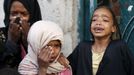 Girls cry after some of their relatives were killed by a Saudi-led air strike in Yemen's capital Sanaa July 13, 2015. Saudi-led air raids killed 21 civilians in Yemen's