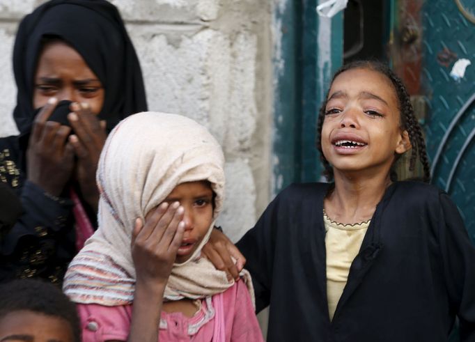 Girls cry after some of their relatives were killed by a Saudi-led air strike in Yemen's capital Sanaa July 13, 2015. Saudi-led air raids killed 21 civilians in Yemen's