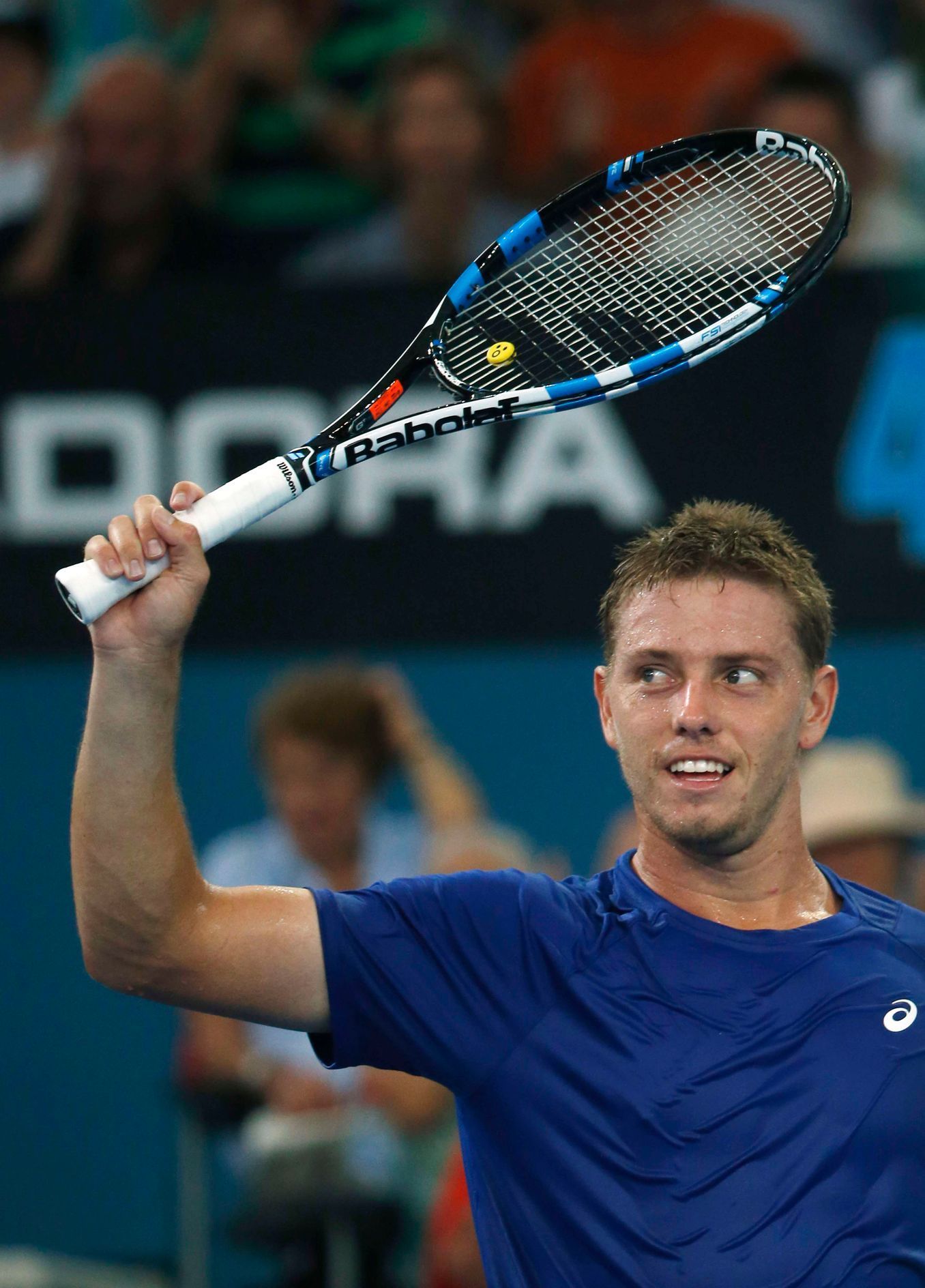 Duckworth of Australia acknowledges the crowd after defeating Simon of France during their Brisbane International tennis tournament first round match in Brisbane