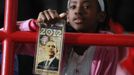 A girl holds up a commemorative ticket as U.S. President Barack Obama speaks during a campaign rally at Mentor High School in Mentor, Ohio, November 3, 2012. REUTERS/Jason Reed (UNITED STATES - Tags: POLITICS ELECTIONS USA PRESIDENTIAL ELECTION) Published: Lis. 3, 2012, 5:29 odp.