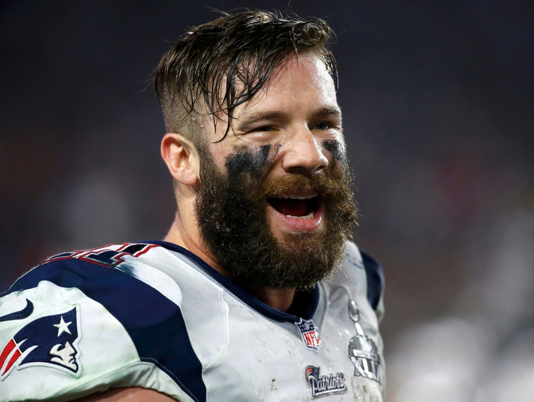 New England Patriots wide receiver Julian Edelman smiles on the sidelines during the NFL Super Bowl XLIX football game against the Seattle Seahawks in Glendale