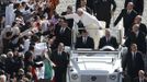 Pope Francis leans out to touch a child's head as he arrives in Saint Peter's Square for his inaugural mass at the Vatican, March 19, 2013. Pope Francis celebrates his inaugural mass on Tuesday among political and religious leaders from around the world and amid a wave of hope for a renewal of the scandal-plagued Roman Catholic Church. REUTERS/Paul Hanna (VATICAN - Tags: RELIGION POLITICS TPX IMAGES OF THE DAY) Published: Bře. 19, 2013, 8:41 dop.