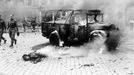 This boy's dead, burning body shows damage done by a V-2 on a main intersection in Antwerp, on a main supply line to Holland.