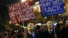 Protesters wearing hold up placards as anti-austerity demonstrators continued into the night near the Spanish parliament in Madrid, September 25, 2012. Anti-austerity demonstrators protested in Madrid ahead of the government's tough 2013 budget that will cut into social services as the country teeters on the brink of a bailout. REUTERS/Paul Hanna (SPAIN - Tags: POLITICS CIVIL UNREST BUSINESS) Published: Zář. 25, 2012, 11:12 odp.