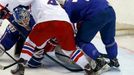 France's goalie Florian Hardy (L) saves in front of Jan Kovar of the Czech Republic (C) during the second period of their men's ice hockey World Championship Group A game