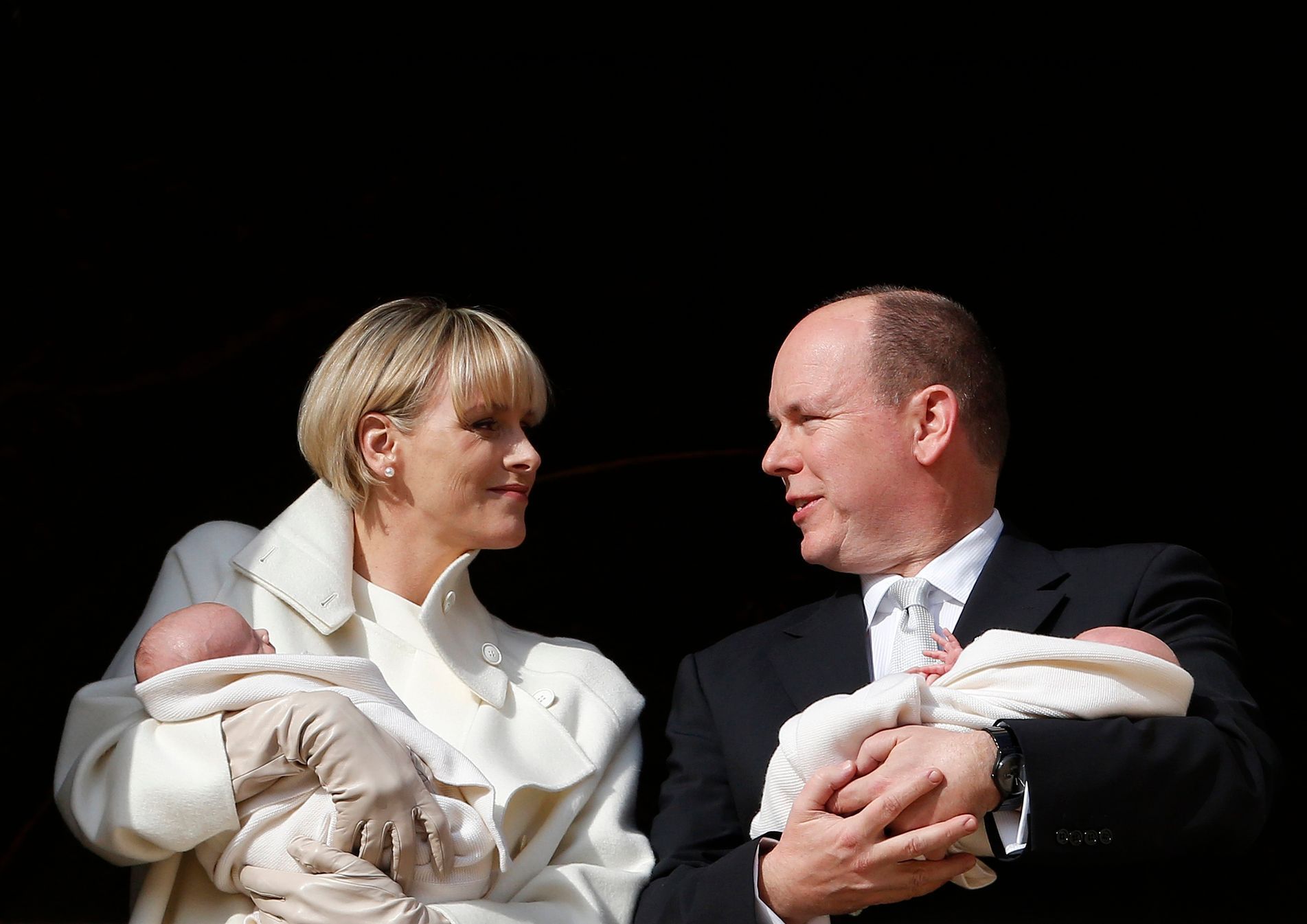 Prince Albert II of Monaco and his wife Princess Charlene hold their twins Prince Jacques and Princess Gabriella as they stand at the Palace Balcony during the official presentation of the Monaco's ne