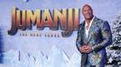 FILE PHOTO: Cast member Dwayne Johnson poses at the premiere for the film "Jumanji: The Next Level" in Los Angeles, California, U.S., December 9, 2019. REUTERS/Mario Anzu