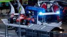 The car of Ferrari Formula One driver Fernando Alonso of Spain is moved to his pit by a truck after it had machine trouble after the Japanese F1 Grand Prix at the Suzuka