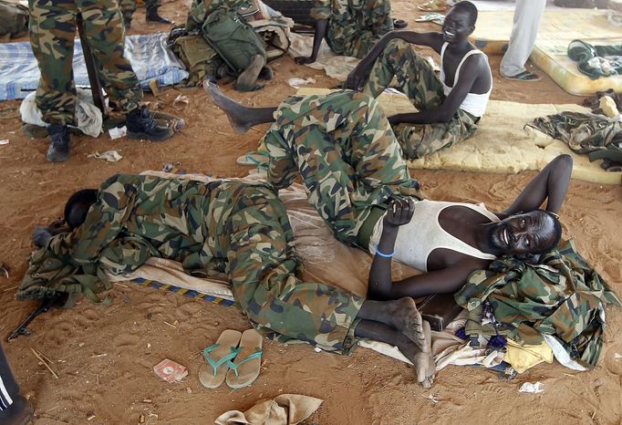 South Sudan's SPLA soldiers rest near an oil field in Unity State