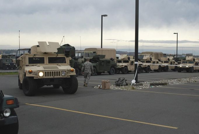 New York Army National Guard Soldiers assigned to the 206th Military Police Company prepare to move out on a road march from New York State Division of Military and Naval Affairs Headquarters to the Farmingdale Armed Forces Reserve Center as part of the New York State response to Hurricane Sandy in this October 28, 2012 handout photo. Sandy is projected to make landfall October 30 on the Eastern Seaboard near New Jersey, bringing strong winds and dangerous flooding to the East Coast from the mid-Atlantic states to New England.. REUTERS/Eric Durr/NYS Division of Military and Naval Affairs/Handout (UNITED STATES - Tags: MILITARY ENVIRONMENT) THIS IMAGE HAS BEEN SUPPLIED BY A THIRD PARTY. IT IS DISTRIBUTED, EXACTLY AS RECEIVED BY REUTERS, AS A SERVICE TO CLIENTS. FOR EDITORIAL USE ONLY. NOT FOR SALE FOR MARKETING OR ADVERTISING CAMPAIGNS