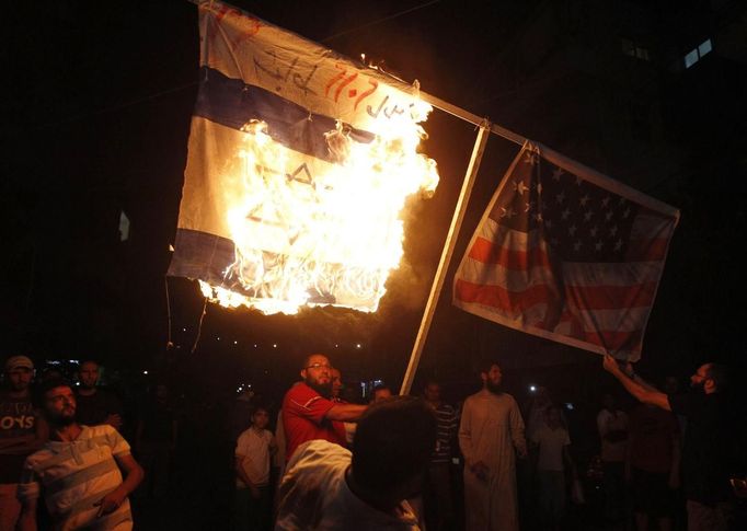 Supporters of Sunni Muslim Salafist leader Ahmad al-Assir burn an Israeli and a U.S. flag during a protest against a film they consider blasphemous to Islam and insulting to the Prophet Mohammad, in Sidon, southern Lebanon September 13, 2012.