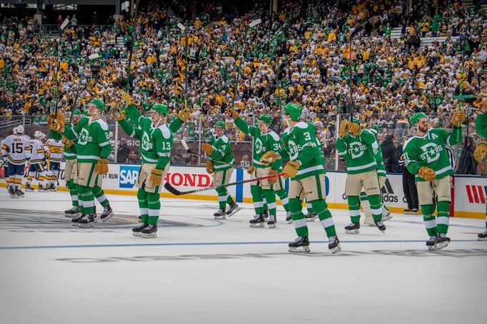 Jan 1, 2020; Dallas, Texas, USA; The Dallas Stars celebrate the win over the Nashville Predators the 2020 Winter Classic hockey game at the Cotton Bowl in Dallas, TX. Man