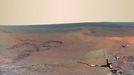 Color Panorama of 'Santa Maria' Crater for Opportunity's Anniversary NASA's Mars Exploration Rover Opportunity is spending the seventh anniversary of its landing on Mars investigating a crater called "Santa Maria," which has a diameter about the length of a football field. This scene looks eastward across the crater. Portions of the rim of a much larger crater, Endurance, appear on the horizon. The panorama spans 125 compass degrees, from north-northwest on the left to south-southwest on the right. It has been assembled from multiple frames taken by the panoramic camera (Pancam) on Opportunity during the 2,453rd and 2,454th Martian days, or sols, of the rover's work on Mars (Dec. 18 and 19, 2010). Opportunity landed in the Meridiani Planum region of Mars on Jan. 24, 2004, Universal Time (Jan. 25, Pacific Time) for a mission originally planned to last for three months. Since that prime mission, the rover has continued to work in bonus-time extended missions. Both Opportunity and its twin, Spirit, have made important discoveries about wet environments on ancient Mars that may have been favorable for supporting microbial life. By mid-January 2011, Opportunity reached a location at the southeastern edge of Santa Maria crater. The rover team developed plans for Opportunity to spend a few weeks investigating rocks at that site during solar conjunction, a period when communications between Earth and Mars are curtailed because the sun is almost directly between the two planets. After completion of its work at Santa Maria, the rover will resume a long-term trek toward Endeavour. This view combines images taken through three different Pancam filters admitting light with wavelengths centered at 753 nanometers (near infrared), 535 nanometers (green) and 432 nanometers (violet). This "natural color" is the rover team's best estimate of what the scene would look like if we were there and able to see it with our own eyes. Seams have been eliminated from the sky portion of the mosaic to better simulate the vista a person standing on Mars would see. Image Credit: NASA/JPL-Caltech/Cornell/ASU