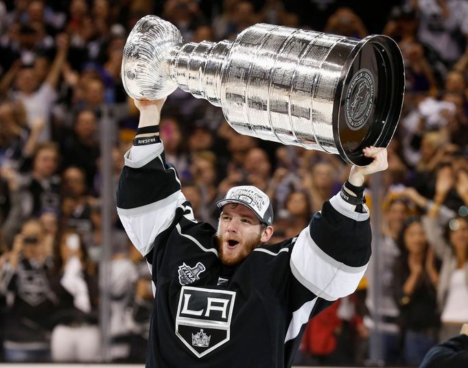 Los Angeles Kings' Jonathan Quick celebrates with the Stanley Cup after the Kings defeated the New York Rangers in Game 5 of their NHL Stanley Cup Finals hockey series in