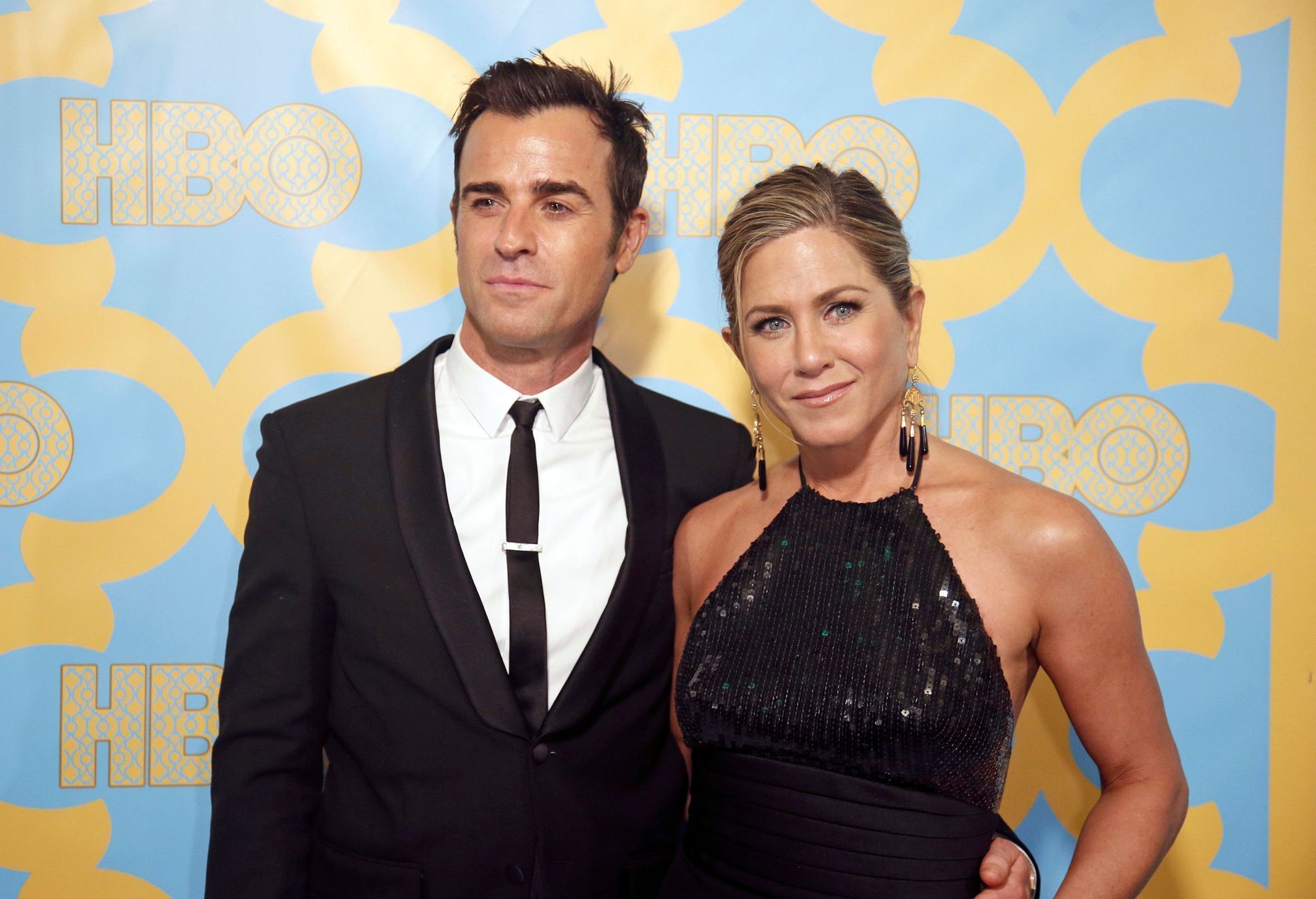 Actors Jennifer Aniston and Justin Theroux pose at the HBO after-party after the 72nd annual Golden Globe Awards in Beverly Hills