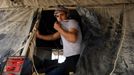 20 Titulek: Gaza's tunnel mugglers on Egypt border idle Popis: A Palestinian worker rests outside a smuggling tunnel in Rafah, on the border between Egypt and the southern Gaza, October 8, 2013. Gaza's tunnel smugglers along the border with Egypt are mostly idle these days. Since the summer, Egypt's military has tried to destroy or seal off most of the smuggling tunnels under the Gaza-Egypt border, a consequence of the heightened tensions between Cairo and the Hamas government in Gaza which is suffering a bad economic recession.