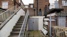 George Kapetanios, his wife and their daughter leave their flat in Potters Bar, on the outskirts of London