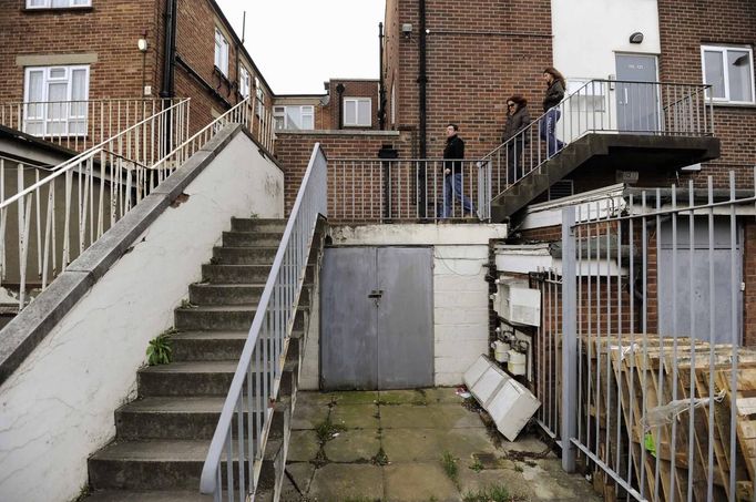 George Kapetanios, his wife and their daughter leave their flat in Potters Bar, on the outskirts of London