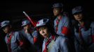 Mid-level government officials dressed in red army uniforms walk inside an old house where former Chinese leader Mao Zedong used to live during their 5-day training course at the communist party school called China Executive Leadership Academy of Jinggangshan, in Jiangxi province, in this September 21, 2012 file photo. China's Communist Party has dramatically stepped up its training of the country's roughly 40 million party and government officials in the past decade. With public scrutiny of cadre behaviour growing via social media, the party is likely to call for continued, and deepened, cadre education at the upcoming 18th Party Congress. At the vanguard of this education drive, alongside a Central Party School in Beijing, are three "Executive Leadership Academies" which opened in 2005 for middle-ranking and senior officials in Shanghai, Yan'an and Jinggangshan. The curriculum covers Marxism, Leninism and Mao Zedong Thought, but students may also take finance courses, receive in-depth media training or role-play crisis management scenarios on everything from disease outbreaks to train wrecks. REUTERS/Carlos Barria/Files (CHINA - Tags: POLITICS SOCIETY TPX IMAGES OF THE DAY) Published: Zář. 24, 2012, 1:32 odp.