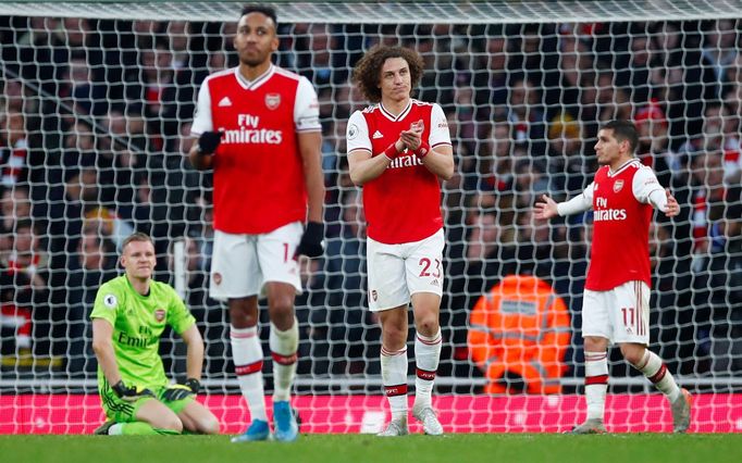 Soccer Football - Premier League - Arsenal v Chelsea - Emirates Stadium, London, Britain - December 29, 2019 Arsenal's Bernd Leno looks dejected with David Luiz, Pierre-E