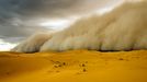 Trekkers Caught In Sandstorm - (Pictured is the sandstorm rising) These unbelievable pictures capture the moment camel trekkers are caught in a sandstorm while crossing the Erg Chebbi Desert. They were taken by photographer, Peter Vruggink, while he was on holiday with his family in Morocco in April. The huge wall of sand which can be seen in the distance coming over the land looks like something that would only be seen in a film.