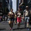 People take part in a topless march in New York