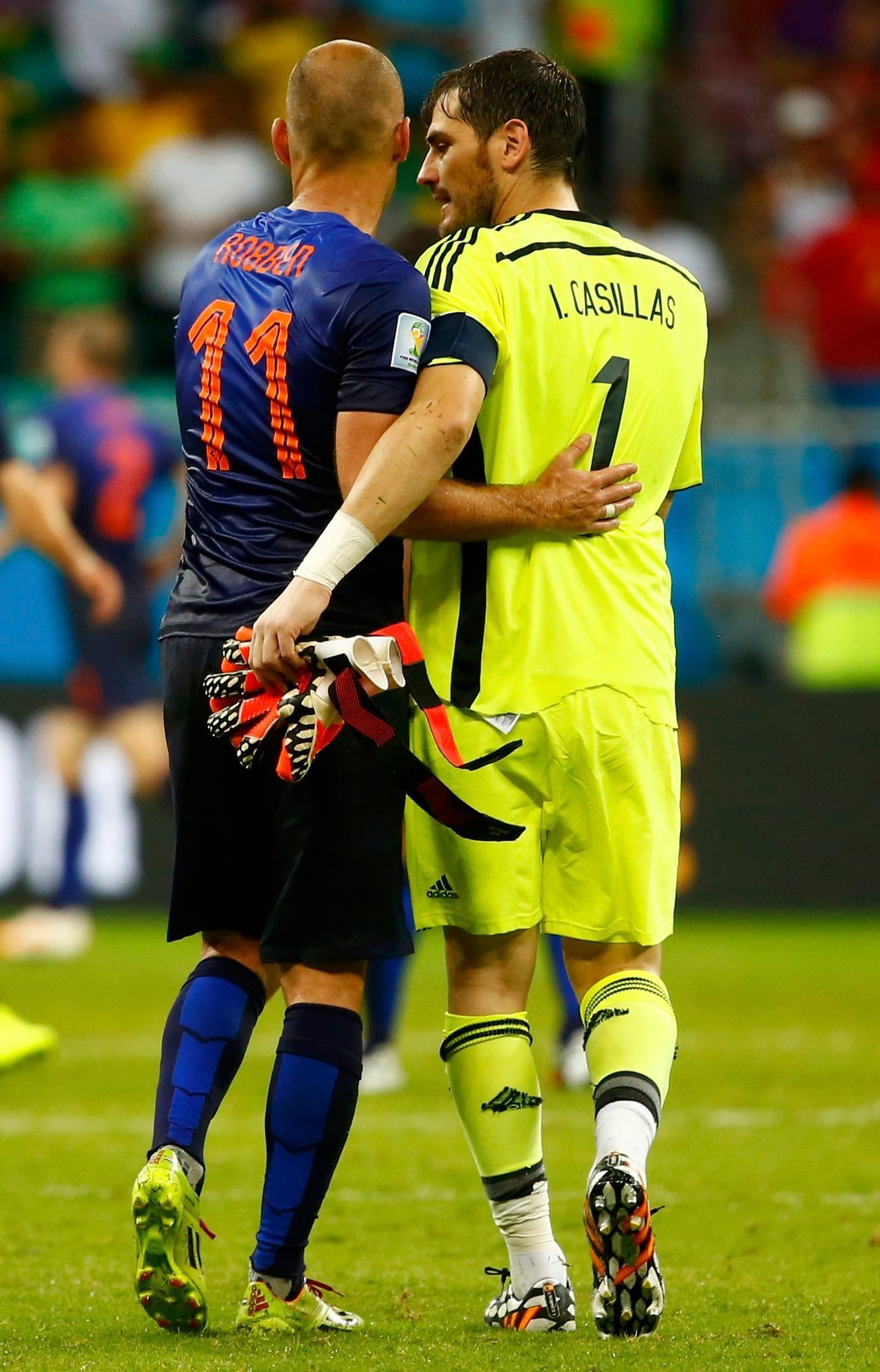 Robben of the Netherlands and Spain's Casillas acknowledge each other after their 2014 World Cup Group B soccer match at the Fonte Nova arena in Salvador