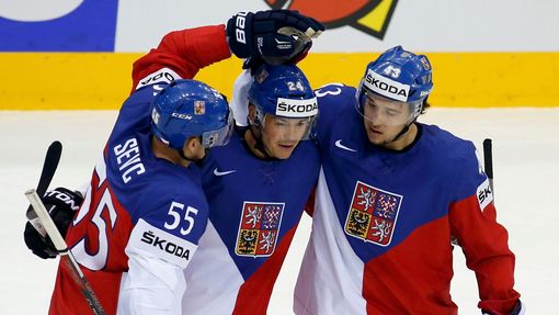 Jiri Hudler of the Czech Republic (C) celebrates his goal against Sweden with team mates Martin Sevc (L) and Jan Kovar (R) during the first period of their men's ice hock