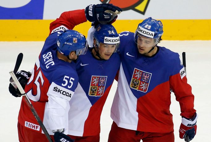 Jiri Hudler of the Czech Republic (C) celebrates his goal against Sweden with team mates Martin Sevc (L) and Jan Kovar (R) during the first period of their men's ice hock