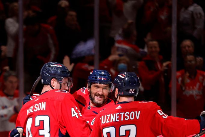 Dec 6, 2021; Washington, District of Columbia, USA; Washington Capitals right wing Tom Wilson (43) celebrates with Capitals left wing Alex Ovechkin (8) and Capitals cente