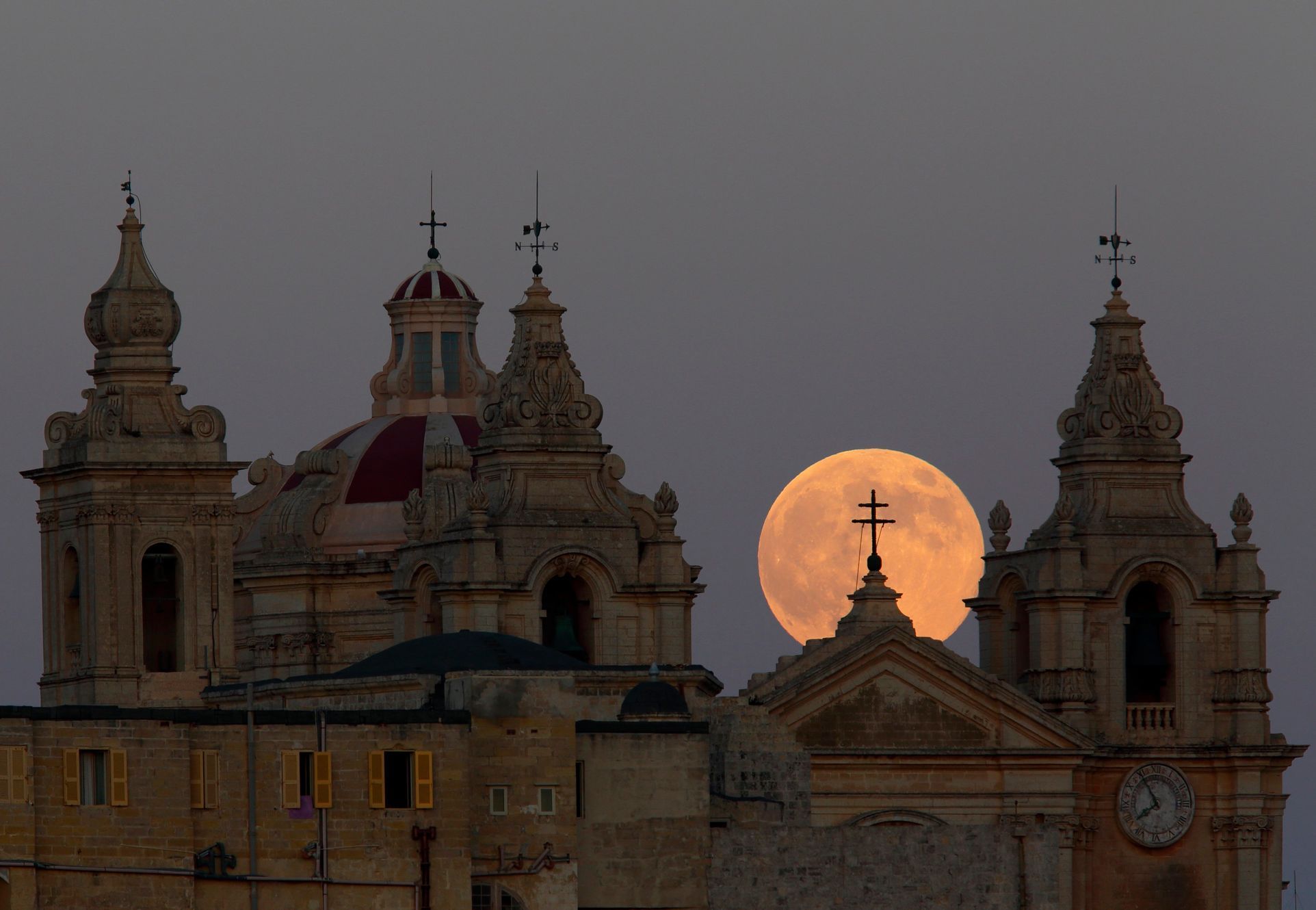 Supermoon rises behind the cathedral in Mdina, Malta's ancient capital city