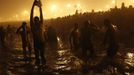 Hindu devotees pray as they attend the first 'Shahi Snan' (grand bath) at the ongoing "Kumbh Mela", or Pitcher Festival, in the northern Indian city of Allahabad January 14, 2013. During the festival, Hindus take part in a religious gathering on the banks of the river Ganges. "Kumbh Mela" will return again to Allahabad in 12 years. REUTERS/Ahmad Masood (INDIA - Tags: RELIGION SOCIETY) Published: Led. 14, 2013, 7:34 dop.