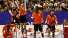 Team Micromax Indian Aces' (2nd L-R) Ana Ivanovic of Serbia, Gael Monfils of France and Fabrice Santoro of France react courtside during their mixed doubles match against