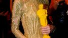 Actress Emma Stone holds a lego Oscar statue at the Governor's Ball following the 87th Academy Awards in Hollywood