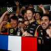 Lotus Formula One driver Grosjean of France celebrates his third place finish after the Japanese F1 Grand Prix at the Suzuka circuit