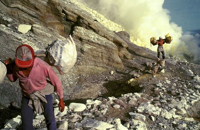 Mining Sulfur by Hand in Kawah Ijen Volcano Men working inside Kawah Ijen volcano, in East Java, Indonesia, one of the last places in the world where people mine sulfur b