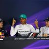Hamilton, seated between Vettel and Rosberg, gestures as he speaks during a news conference after the qualifying session for the Malaysian F1 Grand Prix at Sepang International Circuit outside Kuala L
