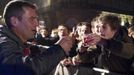 A staff member (L) gestures to a man during the official launch of the 2012 Beaujolais Nouveau wine in the center of Lyon early November 15, 2012. REUTERS/Robert Pratta (FRANCE - Tags: SOCIETY) Published: Lis. 15, 2012, 2:38 dop.