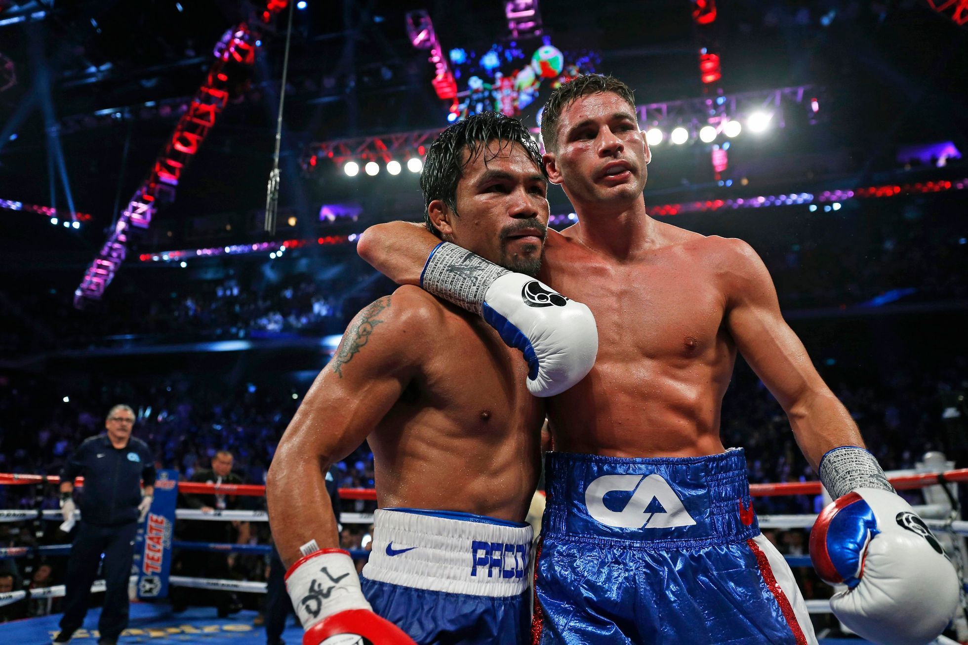 Pacquiao of the Philippines poses with Algieri of the U.S. after winning their WBO 12-round welterweight title fight in Macau