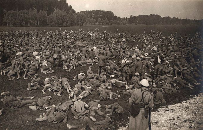 Captured German prisoners lie down in a field at Longueau, on the Western Front, in this August 1, 1916 handout picture.