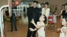 North Korean leader Kim Jong-un, standing near an unidentified woman, watches children playing basketball at a pre-school in Pyongyang in this undated still image aired on video. REUTERS/KRT via Reuters TV (NORTH KOREA - Tags: POLITICS) FOR EDITORIAL USE ONLY. NOT FOR SALE FOR MARKETING OR ADVERTISING CAMPAIGNS. THIS IMAGE HAS BEEN SUPPLIED BY A THIRD PARTY. IT IS DISTRIBUTED, EXACTLY AS RECEIVED BY REUTERS, AS A SERVICE TO CLIENTS. NORTH KOREA OUT. NO COMMERCIAL OR EDITORIAL SALES IN NORTH KOREA Published: Čec. 15, 2012, 5:36 dop.