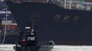 North Korean container ship ''Chong Chon Gang'' docks at the Manzanillo International Container Terminal in Colon City July 16, 2013. Panama detained the North Korean-flagged ship from Cuba as it headed to the Panama Canal and said it was hiding weapons in brown sugar containers, sparking a standoff in which the ship's captain attempted to commit suicide. REUTERS/Carlos Jasso (PANAMA - Tags: MILITARY MARITIME) Published: Čec. 16, 2013, 3:26 odp.