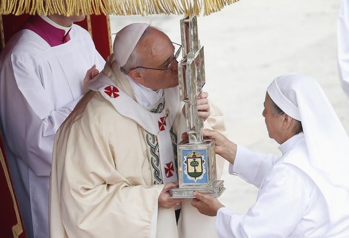 Pope Francis kisses the relics of Maria Guadalupe Garcia Zavala, a candidate for sainthood, as he leads a canonization mass in Saint Peter's Square at the Vatican